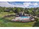 Community pool, playground, and houses surrounded by lush, mature trees and an expansive lawn at 1952 Columbine Ct, Golden, CO 80401