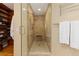 Modern shower with tiled walls, glass door, and built-in bench at 1952 Columbine Ct, Golden, CO 80401