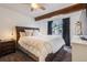 Spacious bedroom with wood beam accents and large window at 10280 W Jewell Ave # B, Lakewood, CO 80232