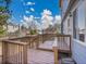 Back deck attached to house featuring wood railings and floors at 8047 Lee Ct, Arvada, CO 80005