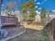 Backyard with deck, fence, and rock bed at 8047 Lee Ct, Arvada, CO 80005