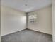 Neutral bedroom with plush carpeting and a bright, sunny window at 8047 Lee Ct, Arvada, CO 80005