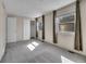 Inviting bedroom with gray carpeting, window, and a closet at 8047 Lee Ct, Arvada, CO 80005