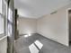 Sunlit bedroom with gray carpet, neutral walls, and large windows at 8047 Lee Ct, Arvada, CO 80005