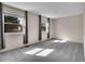 Bright, airy bedroom featuring plush gray carpet and light-filled windows with curtains at 8047 Lee Ct, Arvada, CO 80005