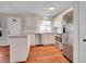 Well-lit kitchen with stainless steel appliances, ample counter space, and stylish cabinetry at 8047 Lee Ct, Arvada, CO 80005