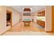 Basement entertainment area featuring a pool table and kitchenette with wood cabinets at 2828 Keystone Dr, Evergreen, CO 80439