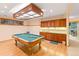 Basement recreation area with a pool table and a wet bar, perfect for entertaining at 2828 Keystone Dr, Evergreen, CO 80439