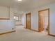 Finished basement with a bathroom, natural light, neutral color palette and hardwood trim throughout at 2828 Keystone Dr, Evergreen, CO 80439