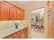 A butler's pantry features custom cabinets, granite countertops, and stainless steel appliances at 2828 Keystone Dr, Evergreen, CO 80439