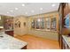 Bright dining area with a large window, hardwood floors, and a view of the trees outside at 2828 Keystone Dr, Evergreen, CO 80439
