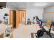Bright exercise room with wall mirrors and exercise equipment in this home's basement at 2828 Keystone Dr, Evergreen, CO 80439