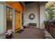 Inviting front porch with stone flooring, seasonal décor, and a charming bench for relaxing at 2828 Keystone Dr, Evergreen, CO 80439