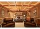 Entertainment room featuring comfortable leather seating and a projector on the ceiling at 2828 Keystone Dr, Evergreen, CO 80439