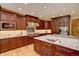 Well-appointed kitchen featuring granite countertops, stainless steel appliances, and custom cabinetry at 2828 Keystone Dr, Evergreen, CO 80439