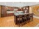 Large open kitchen featuring a large center island with bar stool seating, stainless steel appliances, and custom cabinets at 2828 Keystone Dr, Evergreen, CO 80439