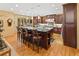 Spacious kitchen features a large center island with bar stool seating, stainless steel appliances, and hardwood floors at 2828 Keystone Dr, Evergreen, CO 80439