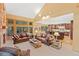 Spacious living room with hardwood floors, vaulted ceilings, comfortable leather furniture, and open floor plan to the kitchen at 2828 Keystone Dr, Evergreen, CO 80439