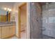 Stylish main bathroom featuring a granite countertop, custom shower, and tile flooring at 2828 Keystone Dr, Evergreen, CO 80439