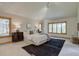 Serene bedroom with vaulted ceilings, large windows, and plush carpeting at 2828 Keystone Dr, Evergreen, CO 80439