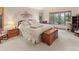 Spacious main bedroom with a large window view and a cozy, carpeted floor at 2828 Keystone Dr, Evergreen, CO 80439
