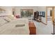 A well-lit bedroom featuring a spacious layout, cozy carpet, and expansive windows for abundant natural light at 2828 Keystone Dr, Evergreen, CO 80439