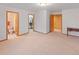 Spacious main bedroom with neutral carpet, walk-in closet and a bathroom at 2828 Keystone Dr, Evergreen, CO 80439