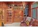 This office has custom cabinets and built in bookcases, a window to the outside, and hardwood floors at 2828 Keystone Dr, Evergreen, CO 80439