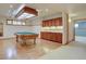 Spacious recreation room with pool table, wet bar, and hardwood flooring at 2828 Keystone Dr, Evergreen, CO 80439