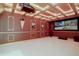 Finished theater room with projector, screen, and custom lighting for an immersive viewing experience at 2828 Keystone Dr, Evergreen, CO 80439
