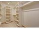 Spacious walk-in closet with built-in shelving and clothing racks provides ample storage space at 2828 Keystone Dr, Evergreen, CO 80439