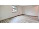 Well-lit bedroom showcases sleek, contemporary flooring and a large window for natural light at 400 S Balsam St, Lakewood, CO 80226