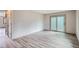 Spacious bedroom with modern flooring and ample natural light from sliding glass doors at 400 S Balsam St, Lakewood, CO 80226