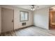 Bright bedroom features wood floors, a ceiling fan, and a window offering natural light at 400 S Balsam St, Lakewood, CO 80226
