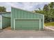 Attached one-car garage with green door, offering convenient parking and storage at 400 S Balsam St, Lakewood, CO 80226