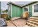 Back patio with brick pavers and stairs offers outdoor enjoyment and relaxation at 400 S Balsam St, Lakewood, CO 80226