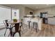 Charming kitchen with granite counters, a breakfast bar, and a dining area for casual meals at 13111 E 103Rd Pl, Commerce City, CO 80022