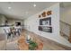 Open-concept living space features hardwood floors, a modern kitchen, and stylish decor at 13111 E 103Rd Pl, Commerce City, CO 80022