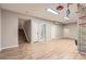 Spacious basement with light wood floors, stairs, and unique ceiling-mounted play equipment at 6401 S Millbrook Way, Aurora, CO 80016