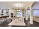 Bright dining area featuring a wooden table, benches, and a sliding door leading to the backyard at 6401 S Millbrook Way, Aurora, CO 80016