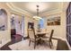 Bright dining room features hardwood floors, a decorative chandelier, and mountain art at 6401 S Millbrook Way, Aurora, CO 80016