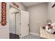 Hallway with patterned tile floor, closet, and accent decorations at 6401 S Millbrook Way, Aurora, CO 80016