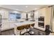 Spacious modern kitchen with island, stainless steel appliances, and white cabinetry at 6401 S Millbrook Way, Aurora, CO 80016