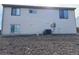 Rear exterior showing neutral siding and an installed air conditioning unit at 2735 S Uravan St, Aurora, CO 80013