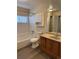 Clean bathroom with a shower-tub combo and a traditional single sink vanity at 2735 S Uravan St, Aurora, CO 80013