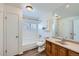 Traditional bathroom with vanity, tub, shower, white tile, and natural light at 2735 S Uravan St, Aurora, CO 80013
