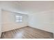 Finished basement bedroom featuring wood-look floors and a window at 2735 S Uravan St, Aurora, CO 80013