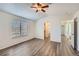 Spacious bedroom with modern gray flooring, natural light, and ceiling fan at 2735 S Uravan St, Aurora, CO 80013