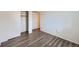 Bright bedroom showcases modern wood flooring and a convenient closet at 2735 S Uravan St, Aurora, CO 80013