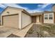 Close up view of a home's entrance, showcasing the siding, front door, and partial garage at 2735 S Uravan St, Aurora, CO 80013